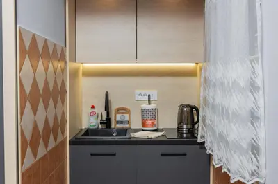 a kitchen with a sink and a counter top at Adzic Apartments in Budva