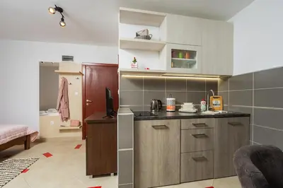 a kitchen with a sink and a counter top at Adzic Apartments in Budva