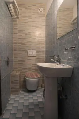 a bathroom with a sink and a toilet at Best Location Old Town Budva Rooms in Budva