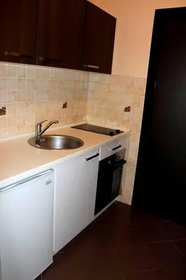 a kitchen with a sink and a counter top at Studio center Budva in Budva