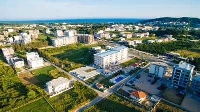 an aerial view of a city with buildings and the ocean at Apartments Paradise in Ulcinj