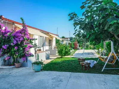 a yard with a playground and a swing at Apartments Paradise in Ulcinj