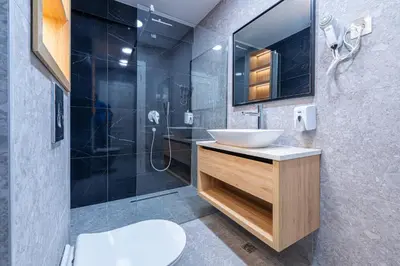 a bathroom with a sink and a shower at Bonita Residence in Dobrota