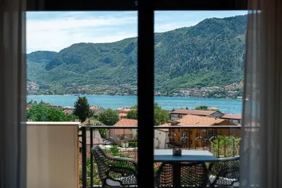 a view of a lake from a window at Bonita Residence in Dobrota