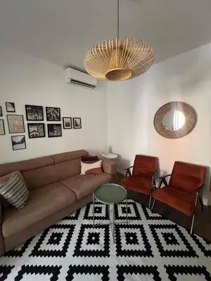 a living room with a couch and a table at Lamada One Bedroom Apartment in Budva