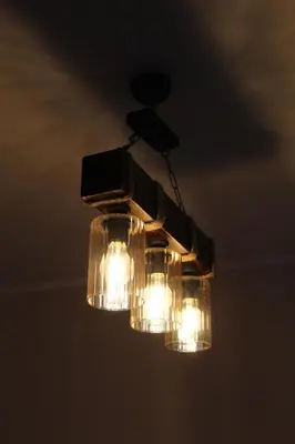 a chandelier is hanging from the ceiling at Mountain Village House in Cetinje