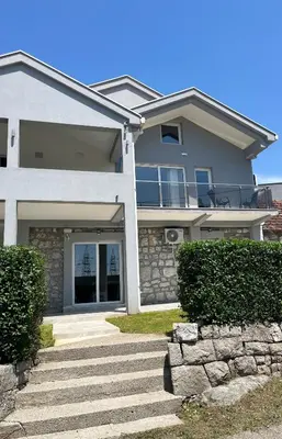 a house with a staircase in front of it at Cezar Apartment 3 in Podgorica