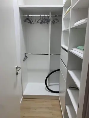 a walk in shower in a white closet at Blue View Luxury Apt in Soho City in Bar