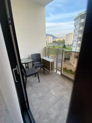 a view of a balcony with a table and chairs at Blue View Luxury Apt in Soho City in Bar