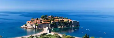 an island in the water with a house on it at Apartment Skada in Sveti Stefan
