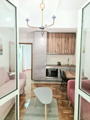 a living room with a couch and a table at Apartman GD in Budva