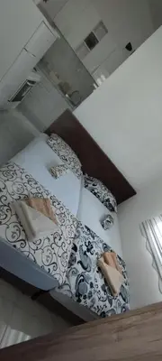 a bed in a room with at Apartmani Murić Bar in Bar