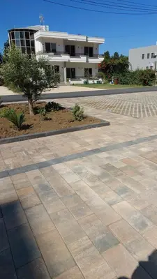 a parking lot in front of a building at Rinia Apartments in Ulcinj
