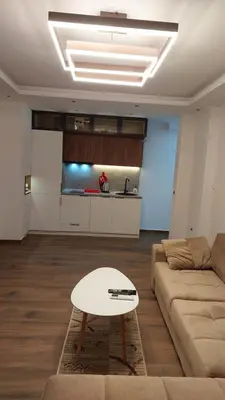 a living room with a couch and a table at Rinia Apartments in Ulcinj