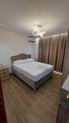 a bedroom with a bed in a room at Rinia Apartments in Ulcinj