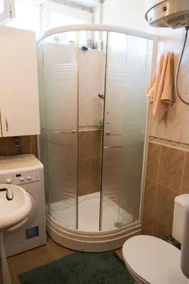 a shower in a bathroom with a toilet and a sink at Apartment Filip in Bar