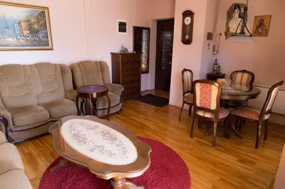 a living room with a couch and a table and chairs at Apartment Filip in Bar