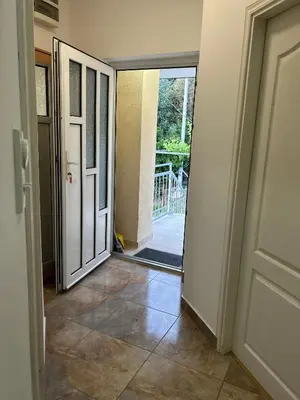 an open door to aoyer with a tile floor at Lazarus Bigova apartments in Tivat
