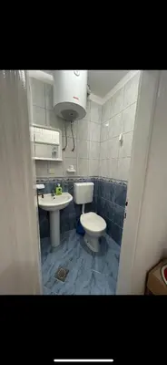 a small bathroom with a toilet and a sink at Lazarus Bigova apartments in Tivat