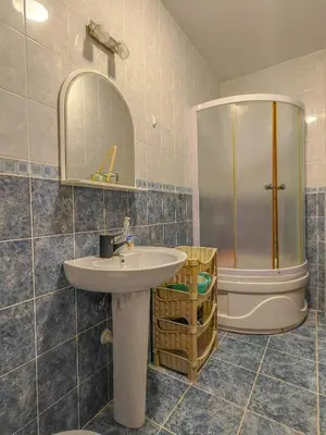 a bathroom with a sink and a shower at The rising sun-Stylish Sea View Apartment in Budva