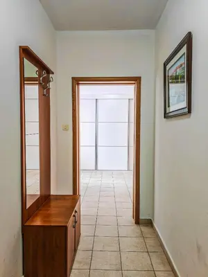 an empty room with a mirror and a hallway at The rising sun-Stylish Sea View Apartment in Budva