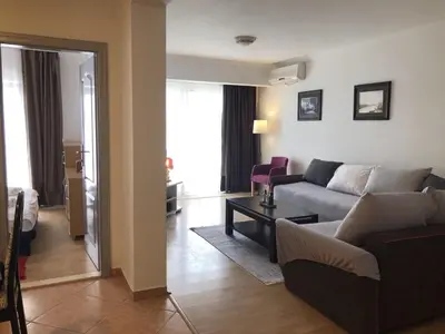 a living room with a couch and a table at Monika in Budva