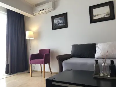 a living room with a couch and a chair at Monika in Budva