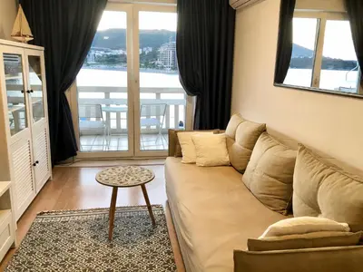 a living room with a couch and a table at Monika in Budva