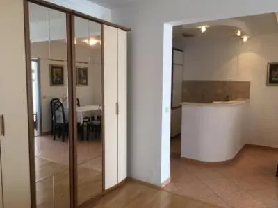 a room with a hallway with a dining room and a table at Monika in Budva
