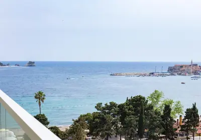 a view of the ocean from the balcony of a building at Sea View Tre Canne Apartment in Budva