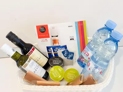 a basket filled with bottles of wine and alcohol at Sea View Tre Canne Apartment in Budva