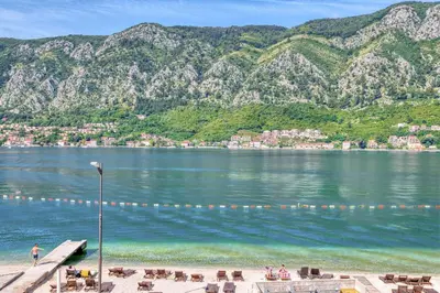 a view of a body of water with mountains at The Golden Luxury Apartments in Kotor
