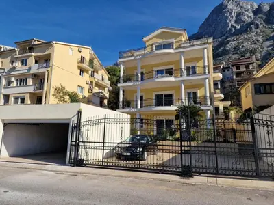 a parking lot in front of some buildings at The Golden Luxury Apartments in Kotor