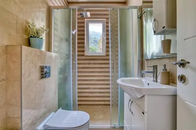 a bathroom with a toilet and a sink at The Golden Luxury Apartments in Kotor