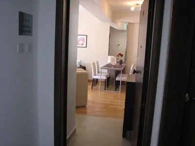 a hallway leading into a living room with a table at Apartment B&S in Budva