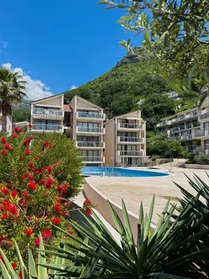a view of the apartment buildings at the beach at V Lux Apartment Sveti Stefan in Sveti Stefan