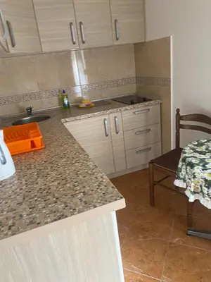 a kitchen with a sink and a counter top at ILIC APARTMENTS in Budva
