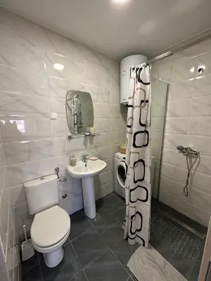 a bathroom with a toilet and a sink at Eastside studio in Podgorica