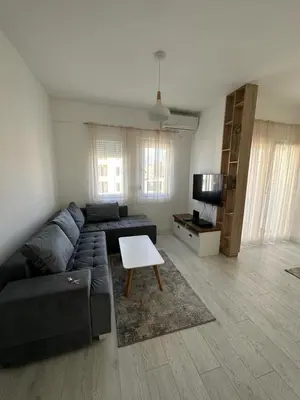 a living room with a couch and a table at Eastside studio in Podgorica