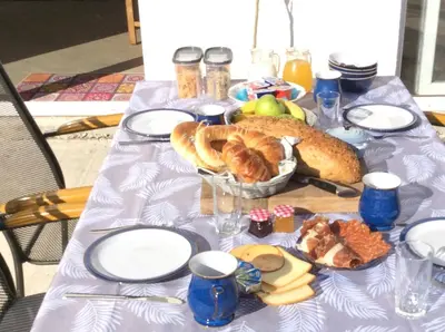 a table with a plate of food on it at Lapčiči View in Budva