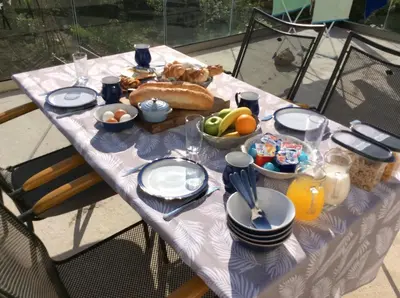 a table with a table cloth with food on it at Lapčiči View in Budva