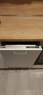 a dvd player is sitting under a table at Biser Apartmani in Podgorica