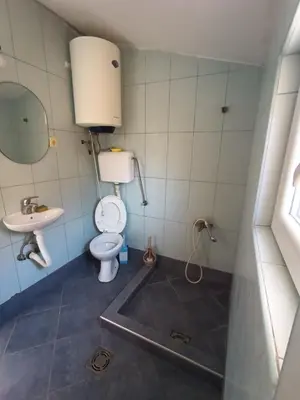a bathroom with a toilet and a sink at TLM Apartments in Budva