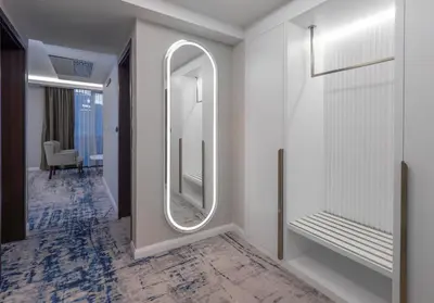 a dressing room with a mirror and a hallway at Hotel Tara Becici in Budva
