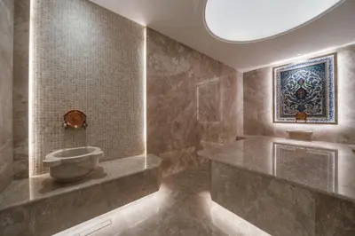 a bathroom with a tub and a painting on the wall at Hotel Tara Becici in Budva