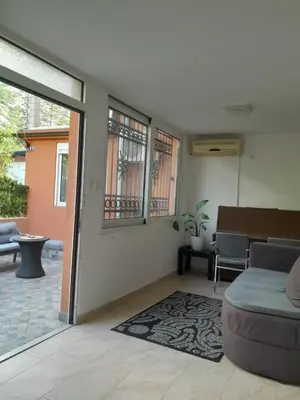 a living room with a couch and a table at Angelia Apartment in Kotor