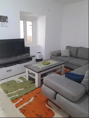 a living room with a couch and a table at Angelia Apartment in Kotor