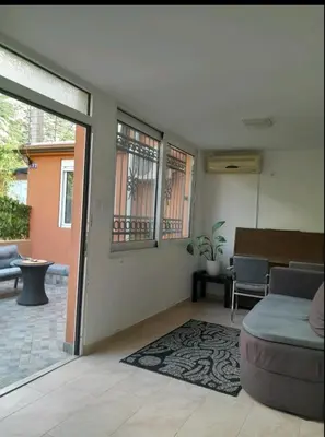 a living room with a couch and a table at Angelia Apartment in Kotor