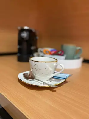 a coffee cup and saucer on a table at Apartment Olivia in Becici