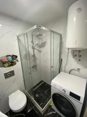 a bathroom with a shower with a toilet and a shower at Apartment Olivia in Becici
